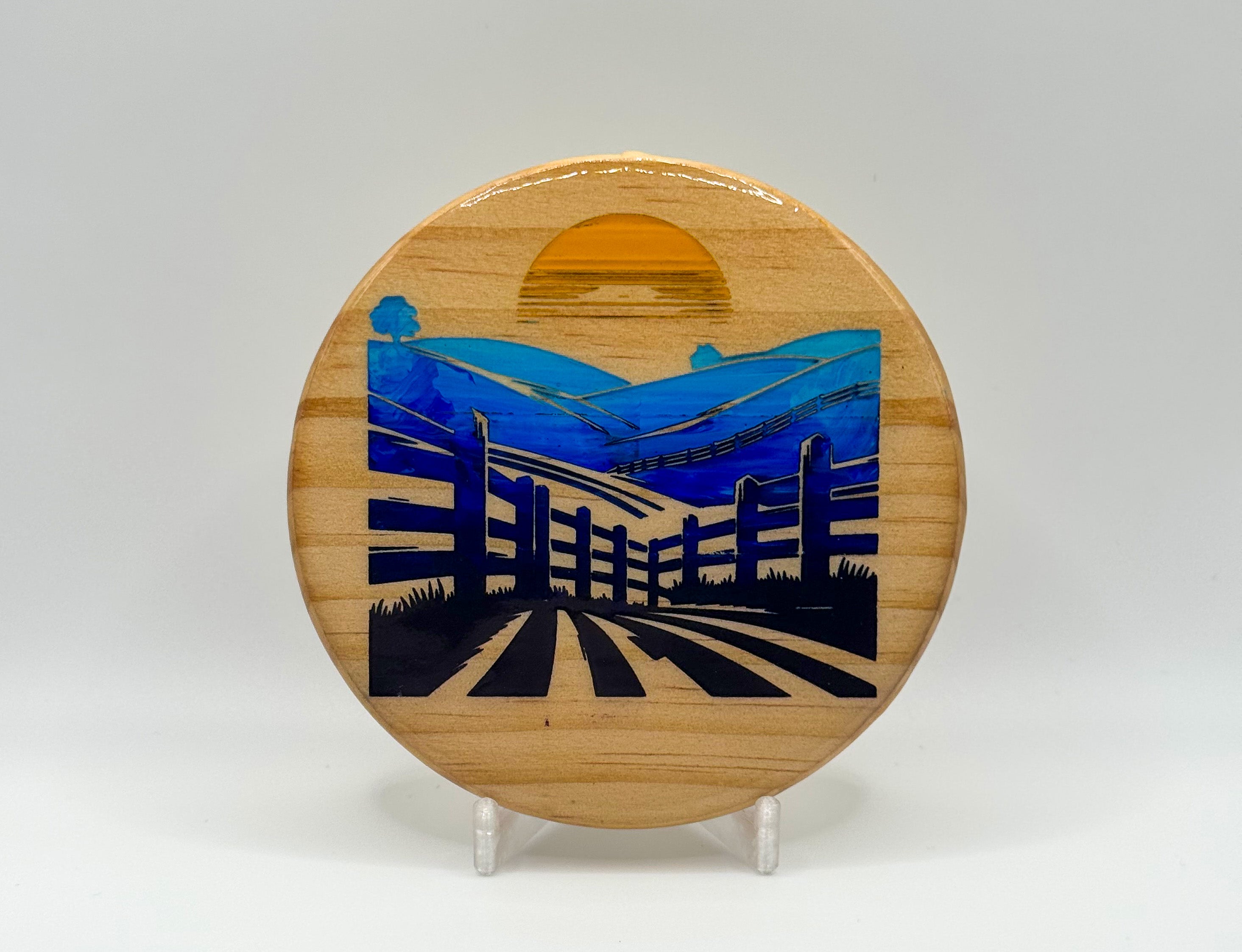Sunrise Over a Fenced Field – Laser Engraved Wood Coaster